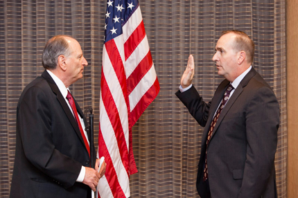 Vice Chairperson James M. Kesteloot swears in Thomas D. Robinson, Commission member representing the Air Force